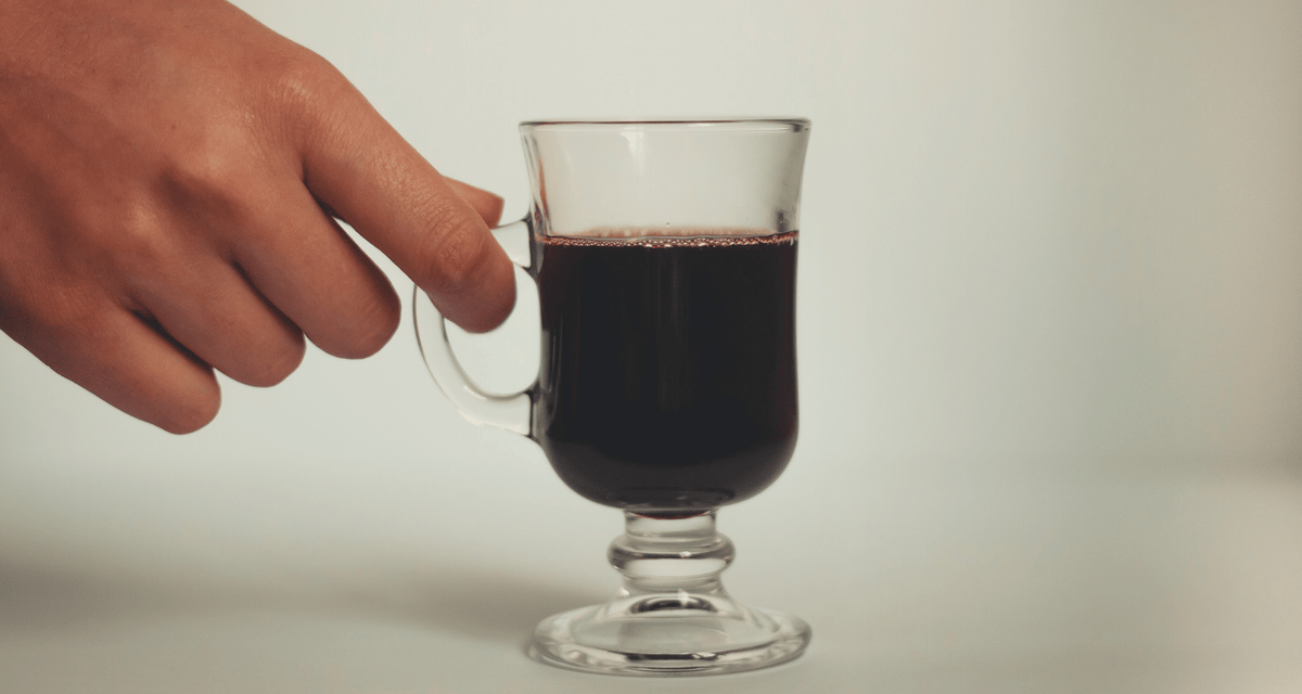 fancy espresso glass against a white background